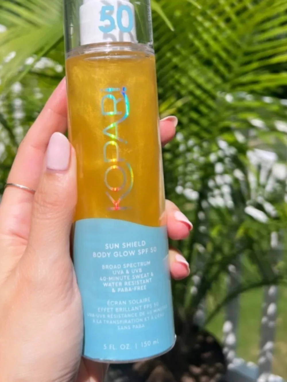 Kopari Sun Shield Body Glow SPF 50 - Gold Liquid with Light Blue Label